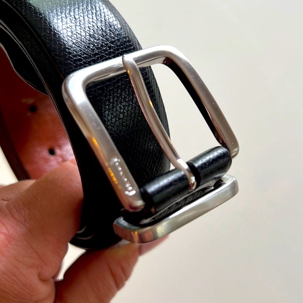 COACH men’s textured black belt with silver buckle. Size 38”